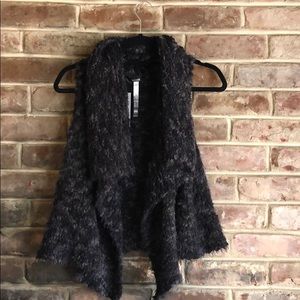 Open sleeveless sweater